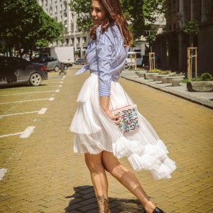 White skirt with book bag