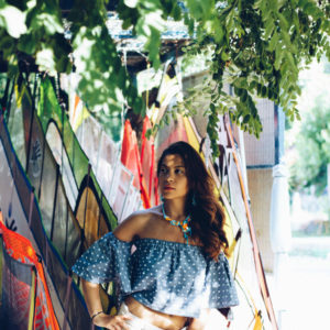 blue off shoulder top in windsurfing club